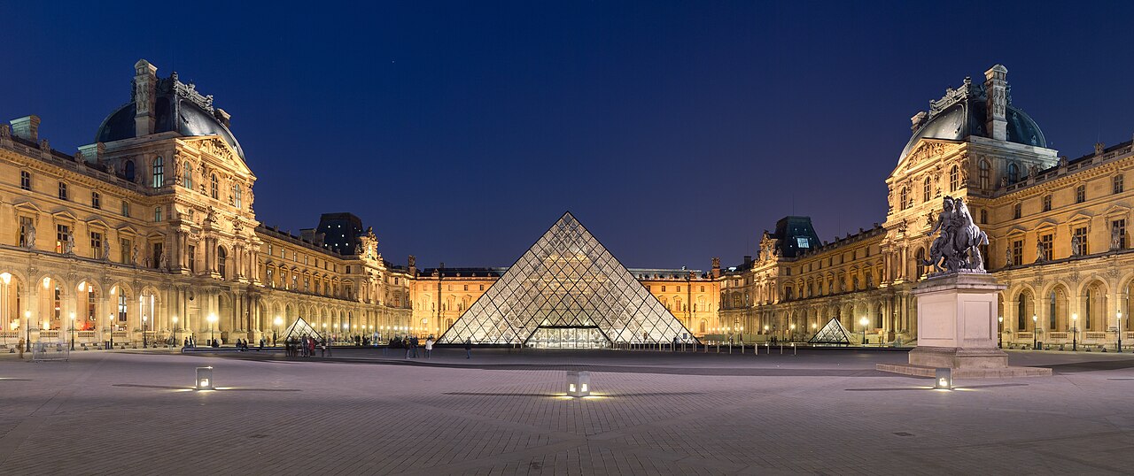 The Louvre and its glass pyramid in the Cour Napoléon, Paris